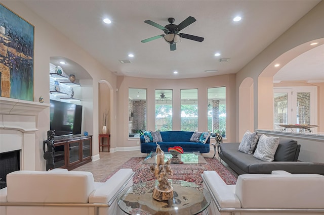 1623 Whitfield St, Sugar Land, TX 77479 - living room featuring arched walkways, ceiling fan, recessed lighting, and baseboards