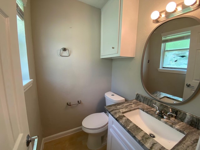 14311 Waterloo Dr, Houston, TX 77045 - bathroom with toilet, vanity, and baseboards
