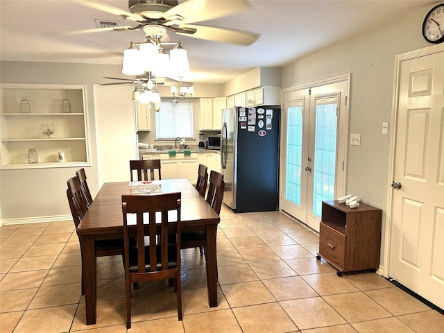 2202 Matilda St, Houston, TX 77039 - dining area with ceiling fan, light tile patterned floors, and a chandelier