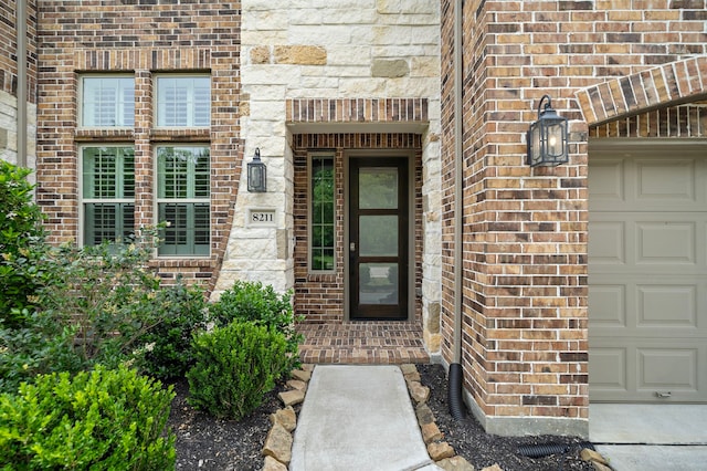 8211 Barristan Bluffs Ct, Magnolia, TX 77354 - property entrance with brick siding and an attached garage