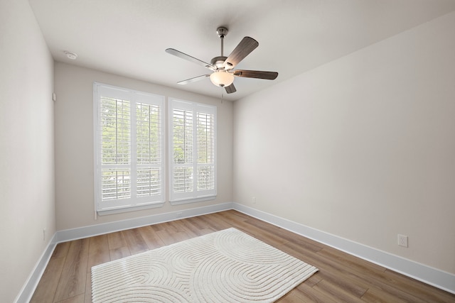 8211 Barristan Bluffs Ct, Magnolia, TX 77354 - unfurnished room featuring ceiling fan, wood finished floors, and baseboards