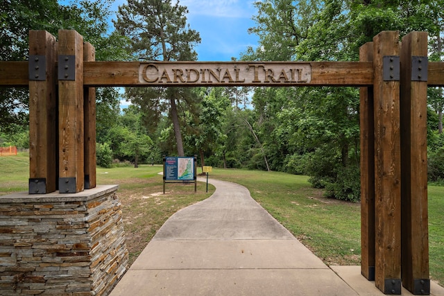 8211 Barristan Bluffs Ct, Magnolia, TX 77354 - view of home's community with a lawn