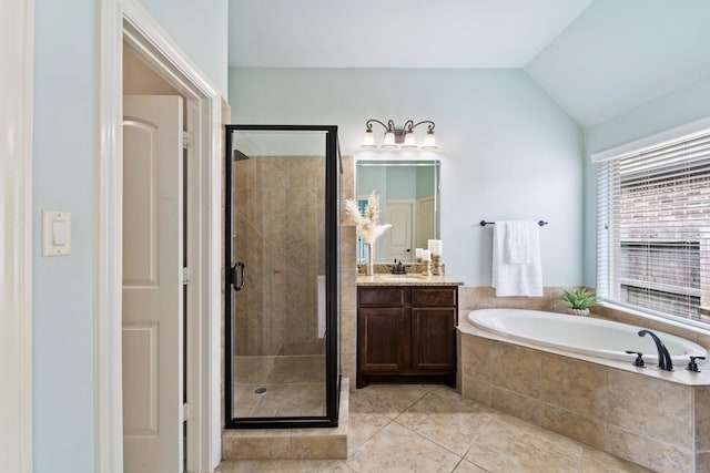 19403 Shady Edge Dr, Cypress, TX 77433 - full bathroom with vanity, a garden tub, a shower stall, tile patterned floors, and lofted ceiling