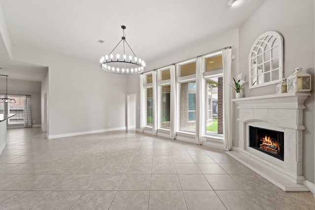 19403 Shady Edge Dr, Cypress, TX 77433 - unfurnished living room with a chandelier, tile patterned flooring, a premium fireplace, and baseboards