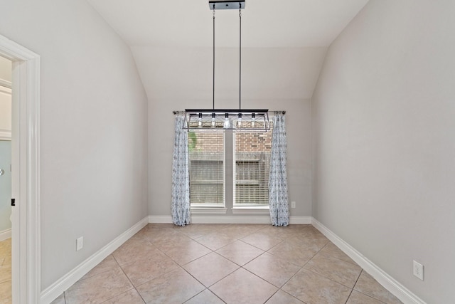 19403 Shady Edge Dr, Cypress, TX 77433 - unfurnished dining area with light tile patterned flooring, vaulted ceiling, and baseboards
