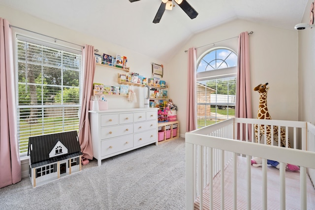 402 Eastwood Dr, Woodbranch, TX 77357 - bedroom with a nursery area, lofted ceiling, light colored carpet, and ceiling fan