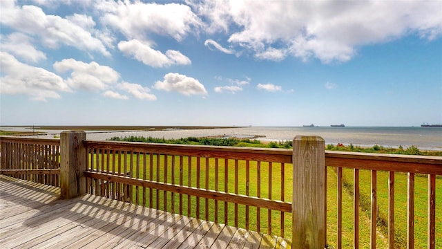 1508 Galveston Ave, Port Bolivar, TX 77650 - wooden deck featuring view of water and beach and a lawn
