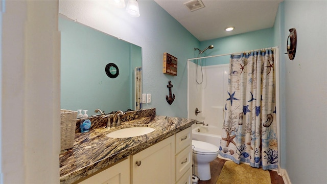 1508 Galveston Ave, Port Bolivar, TX 77650 - bathroom featuring toilet, shower / tub combo with curtain, and vanity