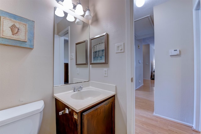 8123 Sweetgum Trace Dr, Houston, TX 77040 - bathroom featuring toilet, vanity, wood finished floors, and baseboards