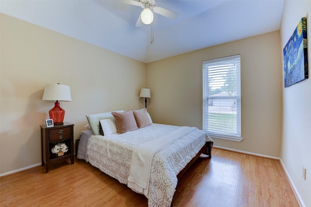 8123 Sweetgum Trace Dr, Houston, TX 77040 - bedroom featuring light wood-type flooring, baseboards, and ceiling fan