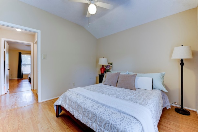 8123 Sweetgum Trace Dr, Houston, TX 77040 - bedroom with light wood-style floors, vaulted ceiling, baseboards, and ceiling fan