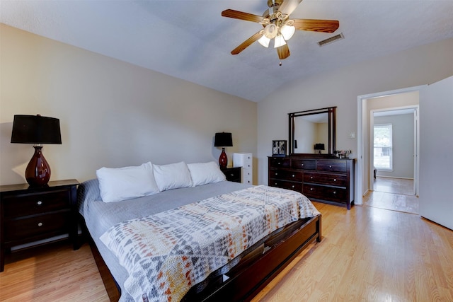 8123 Sweetgum Trace Dr, Houston, TX 77040 - bedroom with light wood-style flooring, lofted ceiling, and a ceiling fan
