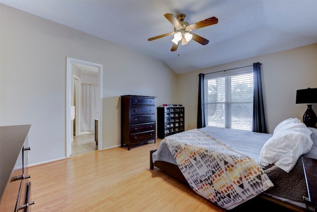 8123 Sweetgum Trace Dr, Houston, TX 77040 - bedroom with wood finished floors, vaulted ceiling, baseboards, a ceiling fan, and connected bathroom