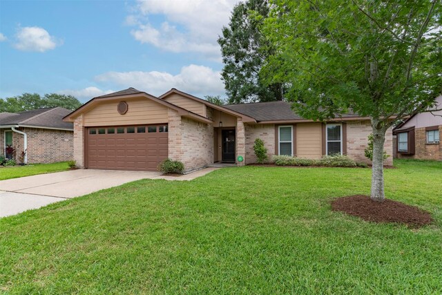 8123 Sweetgum Trace Dr, Houston, TX 77040 - view of front of house featuring an attached garage, brick siding, concrete driveway, a front yard, and roof with shingles