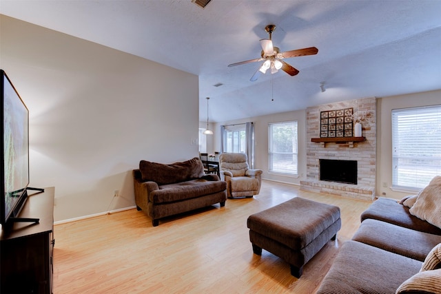 8123 Sweetgum Trace Dr, Houston, TX 77040 - living area with light wood finished floors, baseboards, ceiling fan, a large fireplace, and vaulted ceiling