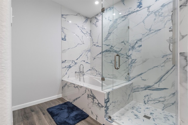 6902 White Ash Ln, Baytown, TX 77521 - full bath featuring a garden tub, a marble finish shower, wood finished floors, baseboards, and recessed lighting