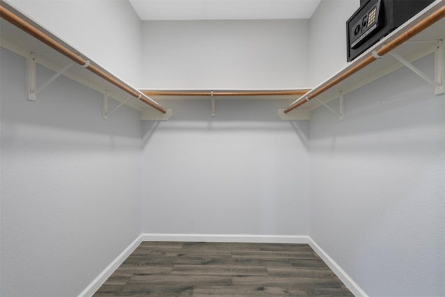6902 White Ash Ln, Baytown, TX 77521 - spacious closet featuring dark wood-style flooring