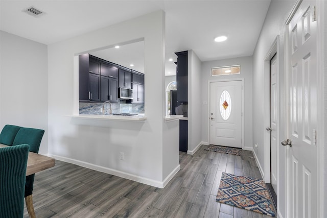 6902 White Ash Ln, Baytown, TX 77521 - entrance foyer with wood finished floors and baseboards