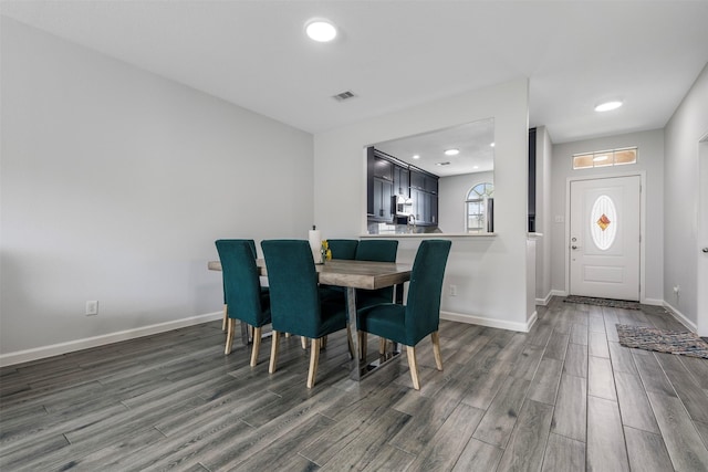 6902 White Ash Ln, Baytown, TX 77521 - dining area with wood finished floors, baseboards, and recessed lighting