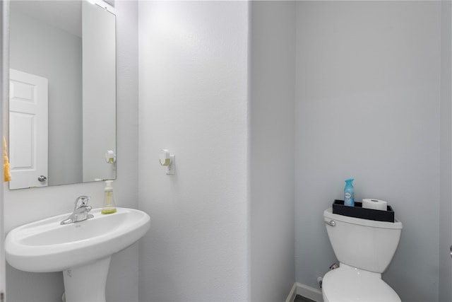 6902 White Ash Ln, Baytown, TX 77521 - bathroom with toilet and a sink