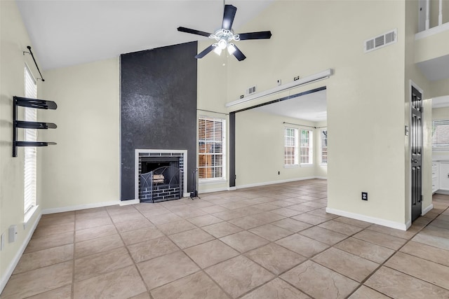 15830 Pipers View Dr, Houston, TX 77598 - unfurnished living room featuring high vaulted ceiling, a ceiling fan, tile patterned floors, a large fireplace, and baseboards