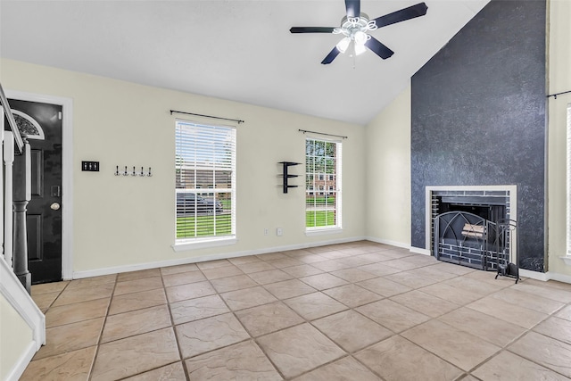 15830 Pipers View Dr, Houston, TX 77598 - unfurnished living room featuring light tile patterned floors, a ceiling fan, a large fireplace, baseboards, and high vaulted ceiling