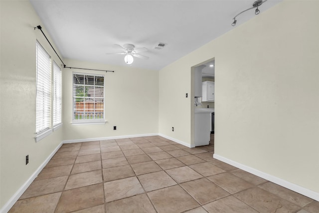 15830 Pipers View Dr, Houston, TX 77598 - spare room featuring a ceiling fan, light tile patterned flooring, and baseboards