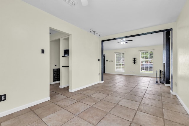 15830 Pipers View Dr, Houston, TX 77598 - empty room featuring a ceiling fan, baseboards, and light tile patterned floors