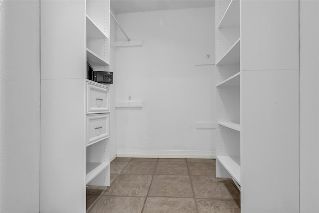 15830 Pipers View Dr, Houston, TX 77598 - spacious closet with tile patterned floors