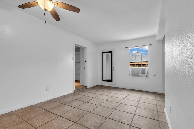 15830 Pipers View Dr, Houston, TX 77598 - spare room with a ceiling fan, cooling unit, light tile patterned floors, baseboards, and a textured wall
