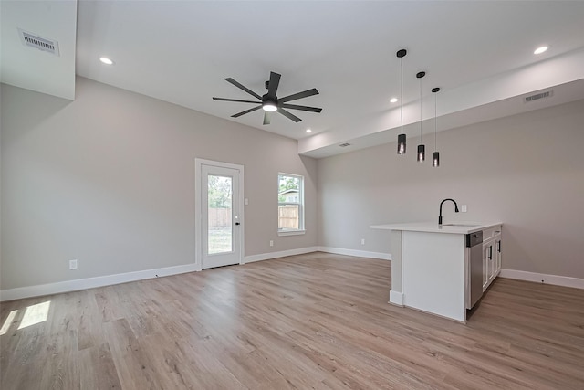 7911 Carver Rd, Houston, TX 77088 - unfurnished living room with a sink, ceiling fan, light wood-style flooring, recessed lighting, and baseboards