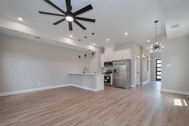 7911 Carver Rd, Houston, TX 77088 - kitchen with stainless steel appliances, open floor plan, light countertops, recessed lighting, and light wood finished floors