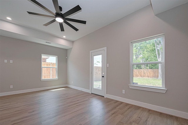 7911 Carver Rd, Houston, TX 77088 - spare room featuring healthy amount of natural light, a ceiling fan, baseboards, wood finished floors, and recessed lighting