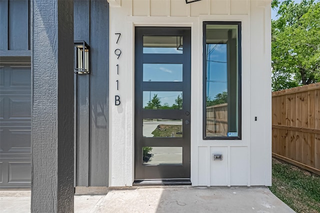 7911 Carver Rd, Houston, TX 77088 - doorway to property with board and batten siding