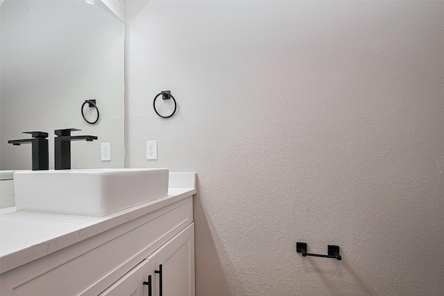 7911 Carver Rd, Houston, TX 77088 - bathroom with vanity and a textured wall