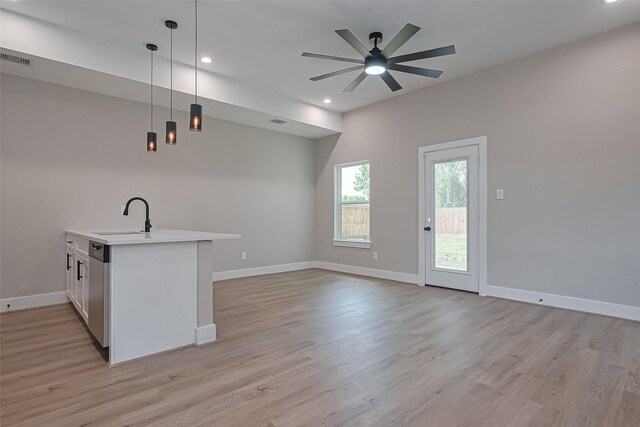 7911 Carver Rd, Houston, TX 77088 - kitchen featuring light countertops, open floor plan, light wood-style flooring, pendant lighting, and recessed lighting