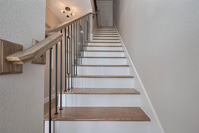 7911 Carver Rd, Houston, TX 77088 - stairway with a textured wall