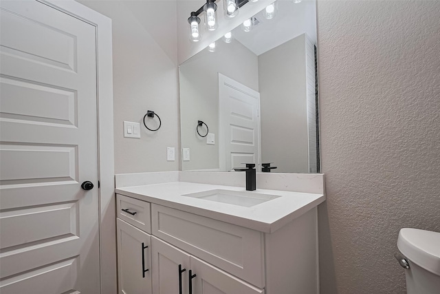 7911 Carver Rd, Houston, TX 77088 - bathroom featuring vanity and a textured wall