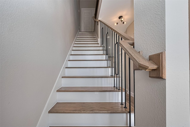 7911 Carver Rd, Houston, TX 77088 - staircase with a textured wall