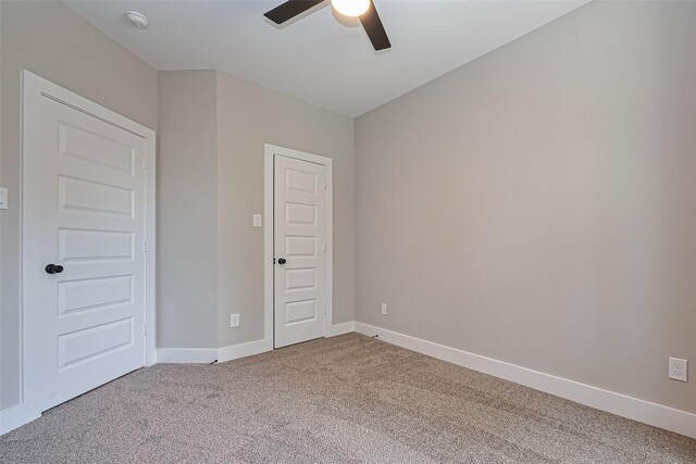 7911 Carver Rd, Houston, TX 77088 - unfurnished bedroom featuring carpet and a ceiling fan
