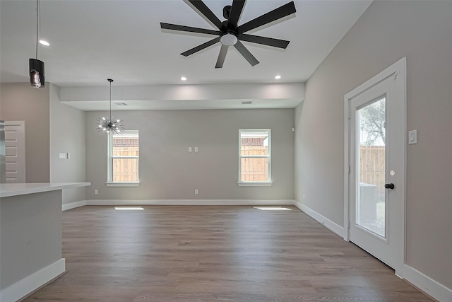 7911 Carver Rd, Houston, TX 77088 - unfurnished living room featuring healthy amount of natural light, wood finished floors, baseboards, and recessed lighting