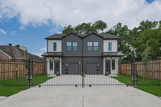 7911 Carver Rd, Houston, TX 77088 - view of front of home with a standing seam roof, driveway, and a metal roof