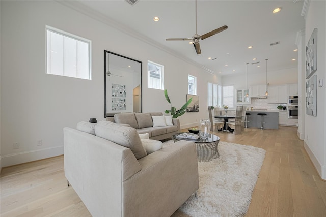 1205 Timbergrove Acres St, Houston, TX 77008 - living area featuring ornamental molding, ceiling fan, light wood-style floors, and recessed lighting