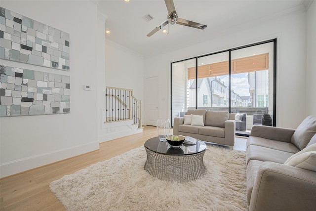 1205 Timbergrove Acres St, Houston, TX 77008 - living area featuring crown molding, stairway, light wood finished floors, recessed lighting, and ceiling fan