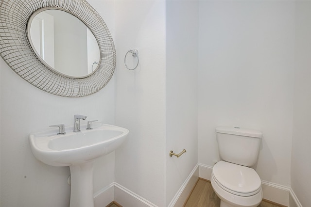1205 Timbergrove Acres St, Houston, TX 77008 - half bathroom featuring toilet and wood finished floors