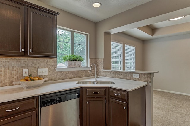 94 S Magnolia Pond Pl, The Woodlands, TX 77381 - kitchen featuring a sink, dishwasher, dark brown cabinets, light countertops, and tasteful backsplash