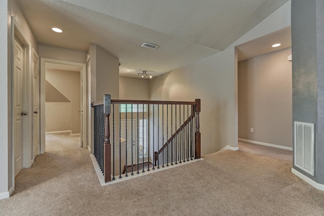 94 S Magnolia Pond Pl, The Woodlands, TX 77381 - hallway featuring an upstairs landing, carpet floors, baseboards, a textured ceiling, and recessed lighting
