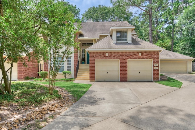 94 S Magnolia Pond Pl, The Woodlands, TX 77381 - view of front of house featuring brick siding, roof with shingles, concrete driveway, and a chimney