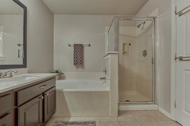 94 S Magnolia Pond Pl, The Woodlands, TX 77381 - bathroom featuring vanity, a garden tub, tile patterned floors, and a stall shower