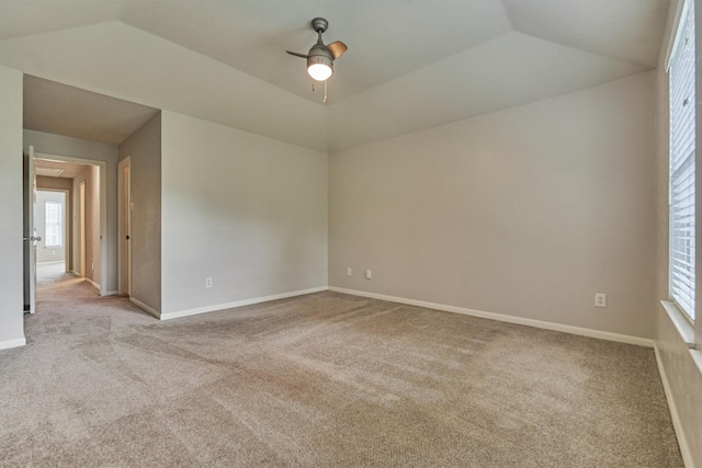 94 S Magnolia Pond Pl, The Woodlands, TX 77381 - spare room featuring carpet flooring, a ceiling fan, vaulted ceiling, and baseboards